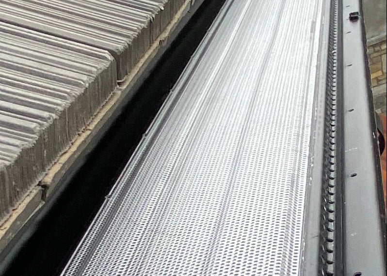 Aluminum micro-mesh gutter guard installed inside the gutter providing fine debris filtration